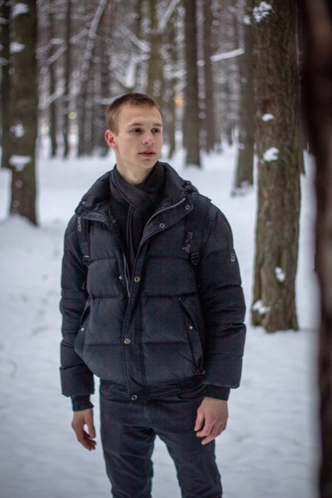 Belarus - Young guy stands in the snow