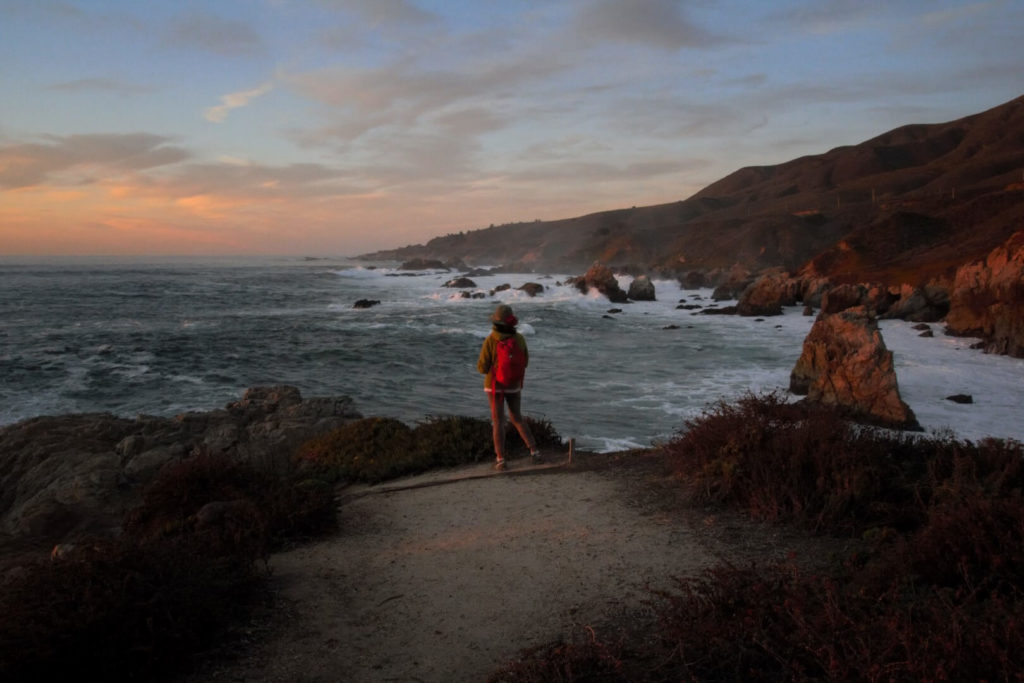 Girl watching the ocean in California